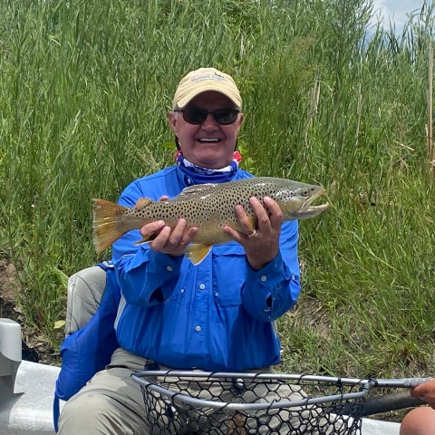 a person holding a fish